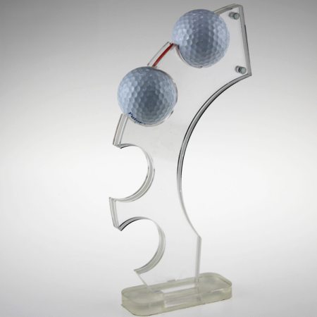 Clear acrylic golf ball display stand holding golf balls