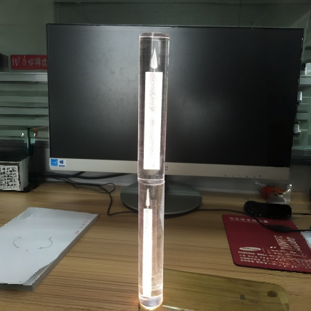 Clear acrylic round rod with laser engraved candle pattern for lighting fixtures illuminated from the bottom