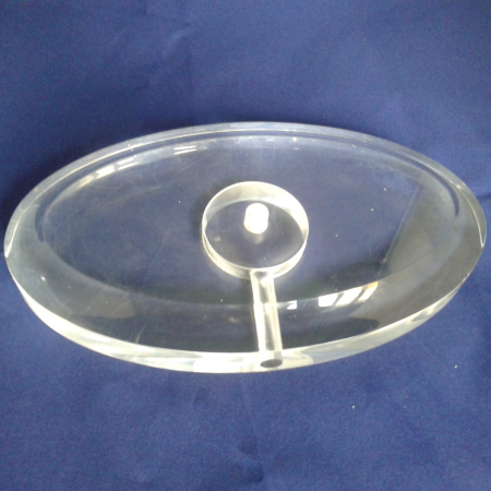 Oval clear acrylic lamp base with a central holder and wire channel